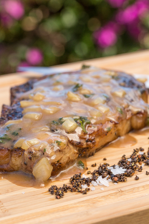 Boneless rib eye steak topped with Steak Diane sauceの写真素材