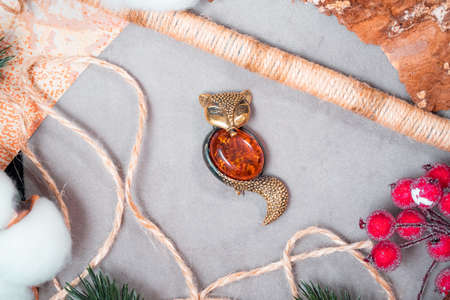 A brooch in the form of a fox made of bronze and amber.の写真素材