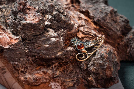 Bronze and amber skates on a wooden backgroundの写真素材