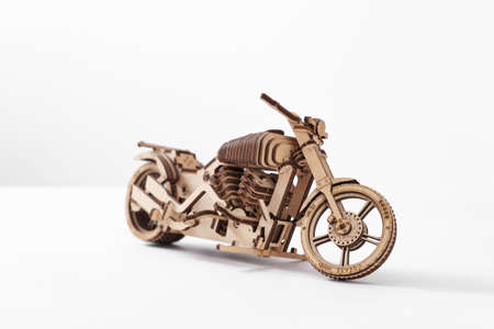 Designer of wood in the shape of a motorcycle on a white backgroundの写真素材
