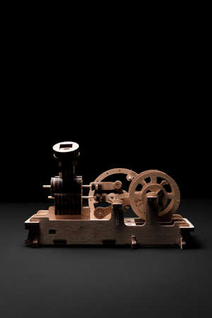 A wooden engine on a black background close-upの写真素材