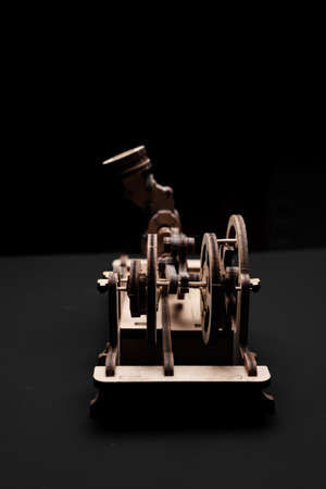 Model engine made of wood and plywood on a black backgroundの写真素材
