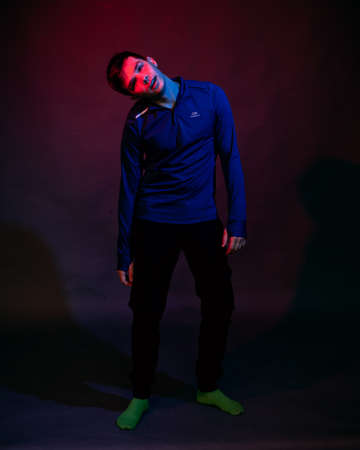 Portrait of a man with red and blue light