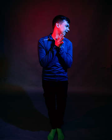 Portrait of a young man with rich colorsの写真素材