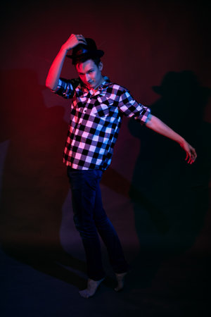 Dancing guy with red and blue lightの写真素材