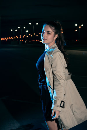 Girl in the background of the night cityの写真素材