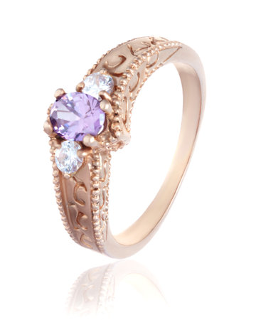 Gold ring with precious stones on a white backgroundの写真素材