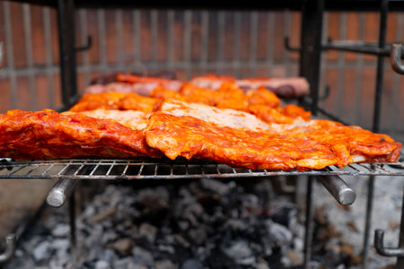 Grilled pork ribs on a barbecue grill. Close-up.の写真素材