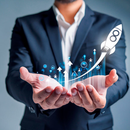 Businessman hand holding a rocket with growing graph and pie chart.の素材