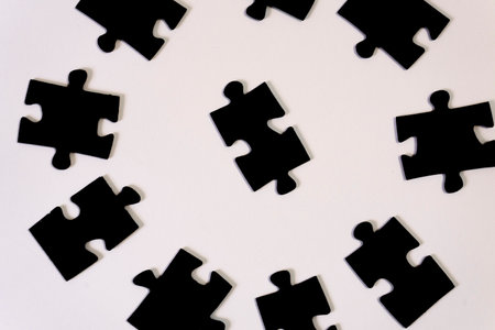 Jigsaw puzzle pieces on white background. Top view. Copy space.の写真素材