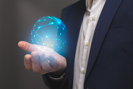 Businessman holding a global network hologram in his hand. 3D renderingの写真素材