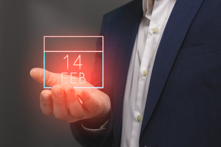 Businessman hand showing calendar date on virtual screen. Business and technology concept.の写真素材