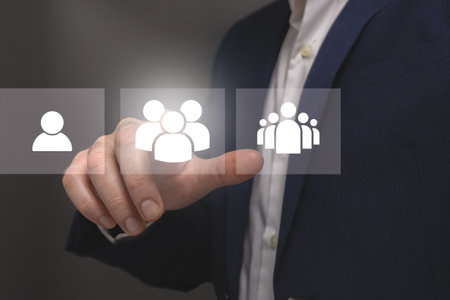Businessman pressing social network icon on virtual screen. Business and technology concept.の写真素材