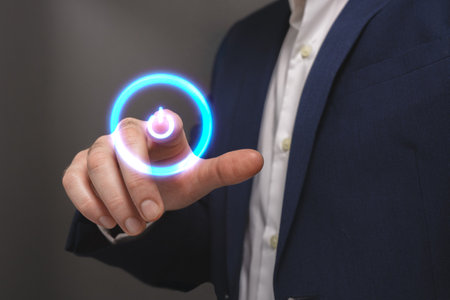 Businessman pressing button on virtual screen, closeup. Technology conceptの写真素材