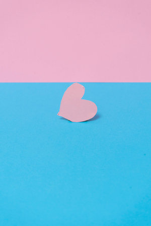 a heart of roses on a blue and pink background.の写真素材