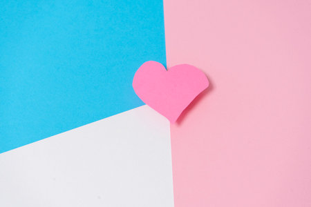 1 pink heart on a white, blue and pink background. Valentine's Day conceptの写真素材