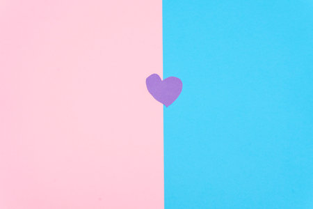A purple heart on a pink and blue background, Valentine's Day background. Valentine's Day concept