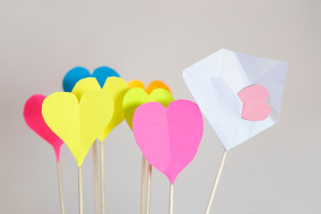 colorful paper hearts on stick for valentine's day backgroundの写真素材