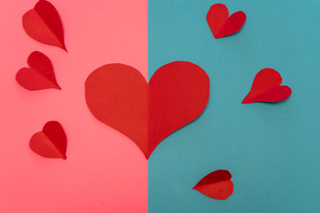 Paper hearts and envelope on red background. Valentine's day concept.の写真素材