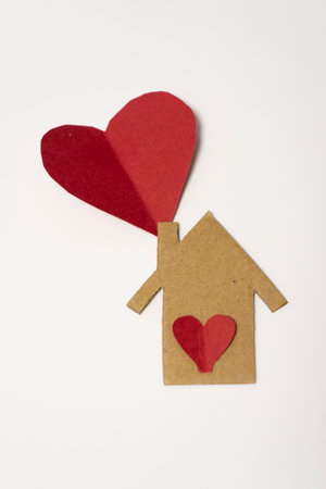 Paper heart and house on white background, valentines day conceptの写真素材