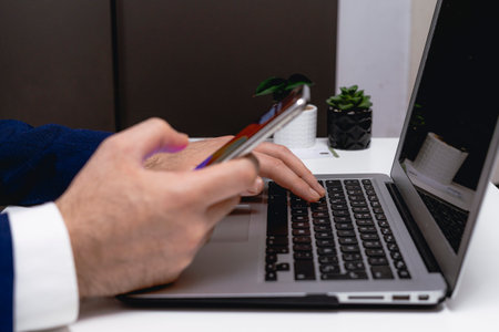 Close-up of a man's hands holding a credit cardの写真素材