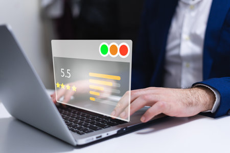 Businessman using laptop with rating system on screen. Customer service concept.の写真素材