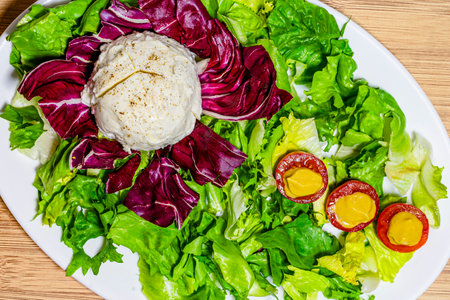 Healthy salad with poached eggs, radicchio and lettuceの写真素材