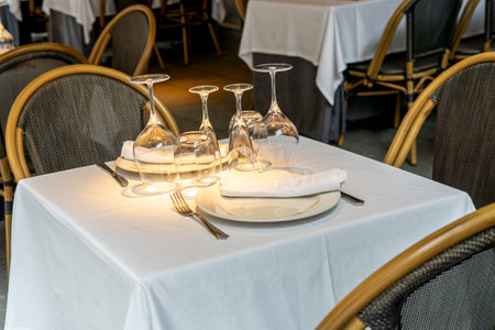 Restaurant table setting with wine glasses and cutlery.の写真素材