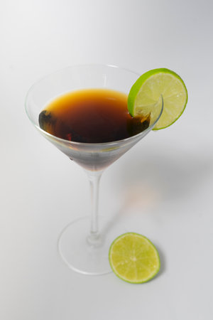 Cocktail with lime on a white background. Alcoholic drink.の写真素材