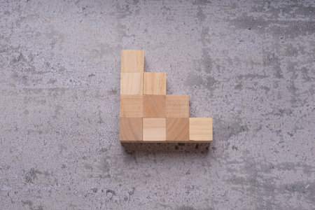 Top view of wooden block stacking as step stair on cement floor backgroundの写真素材