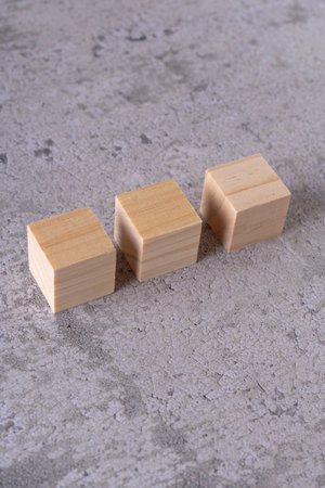 Wooden blocks on a concrete background. Business concept. Copy space.の写真素材