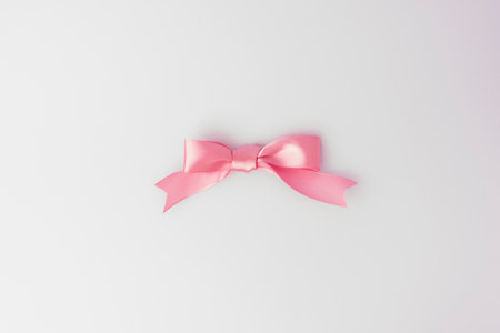Pink bow isolated on white background with copy space for your text.