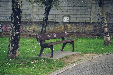 old wooden bench abandoned in the street