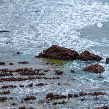 rocks and waves in the water in the sea