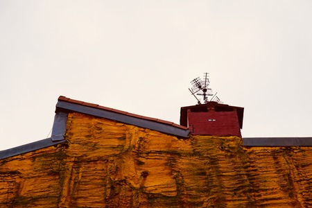 television aerial on the rooftop building, antenna on the roof in Bilbao city. Spainの写真素材