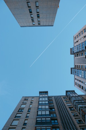 airplane flyin in the blue sky in Bilbao city. Spain.の写真素材