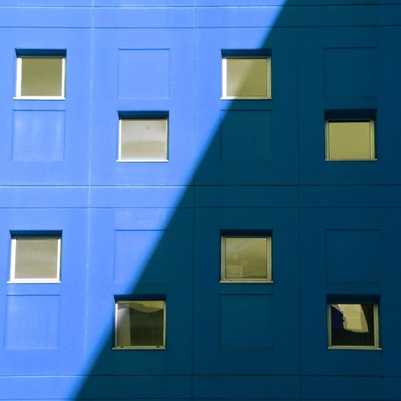 window on the blue facade in Bilbao city. Spainの写真素材
