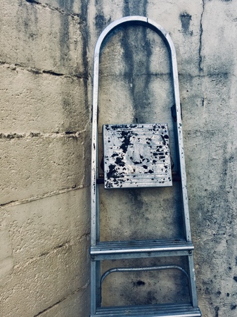 old metallic ladder on the wall in the streetの写真素材