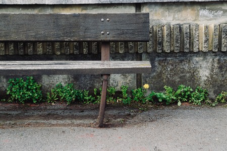 wooden bench in the public park in the street