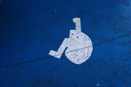 wheelchair traffic sign on the road in the streetの写真素材
