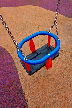 swing on the playground on the streetの写真素材