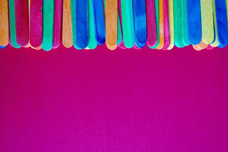 colorful wooden sticks decoration, multi colored backgroundの写真素材
