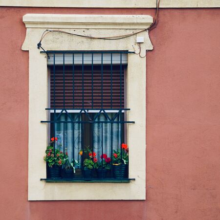 old window on the pink facade of the house in Bilbao city Spainの写真素材