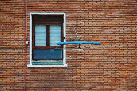 old window on the old facade of the house in Bilbao city Spain