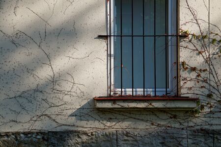 old window on the old facade of the house in Bilbao city Spainの写真素材