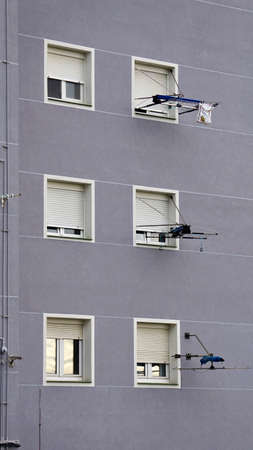 window on the gray facade of the house, architecture in Bilbao city Spain