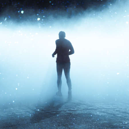 people walking on the street with fog in Bilbao city, Spainの写真素材