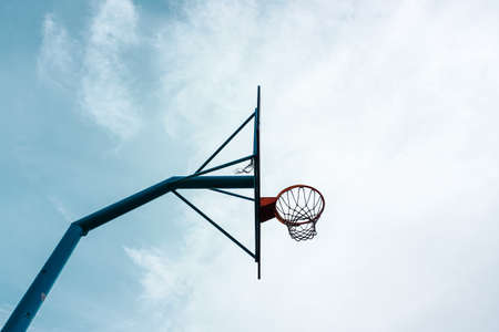 street basketball hoop and blue skyの写真素材