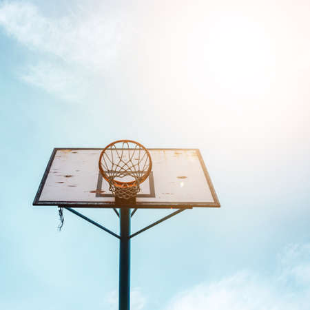 street basketball hoop and blue skyの写真素材