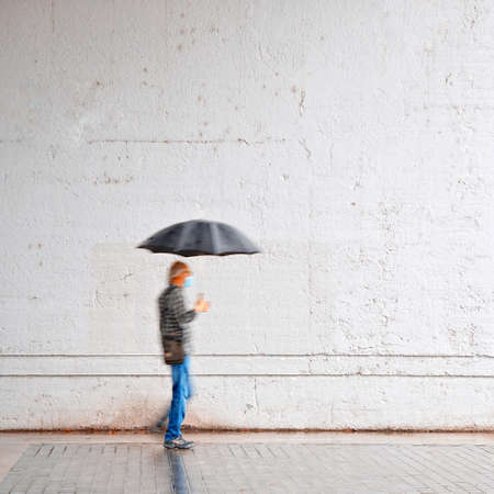 people with an umbrella in rainy days in spring season, Bilbao city, Spain